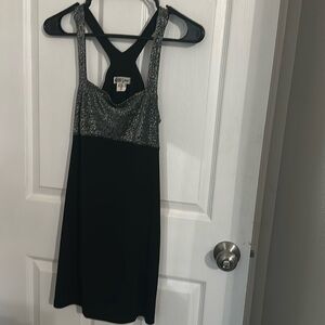 Dressy Shimmer Silver Top with Black Bottom. Criss-Cross back . Open back.